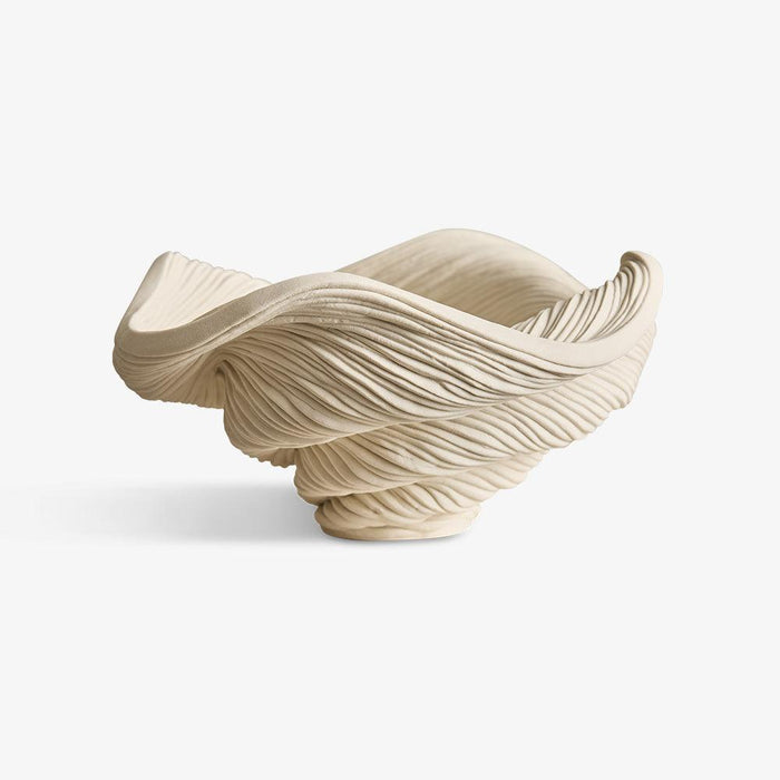 Coiled white porcelain small bowl textured with wavy organic ripples forming a sculptural design