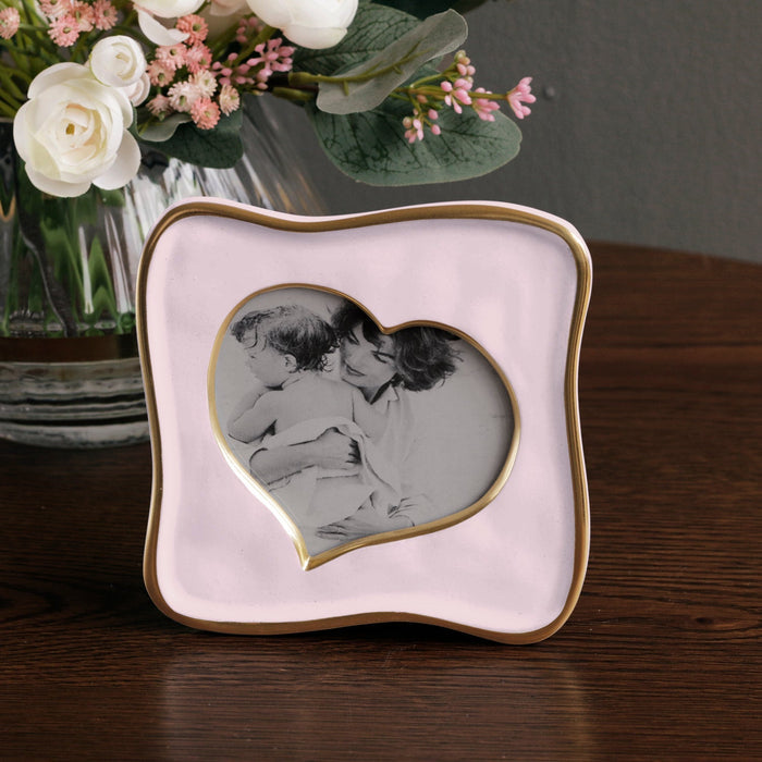 Beatriz Ball Frame Encanto Curved Heart 5 x 5 — Beside a floral arrangement