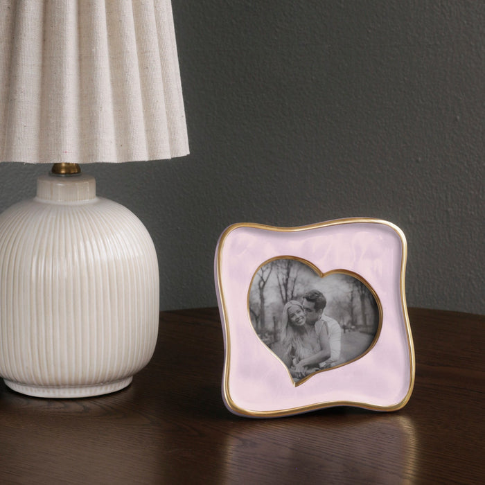 Beatriz Ball Frame Encanto Curved Heart 5 x 5 — Beside a white lamp