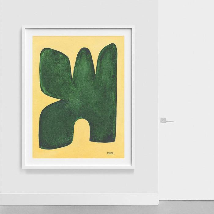 Abstract print featuring a dark green blob-like shape with three peaks on a yellow background in a white frame hanging