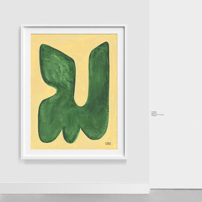 Abstract print La figure du vivant 165 with a dark green shape on yellow in a white frame hanging on a wall