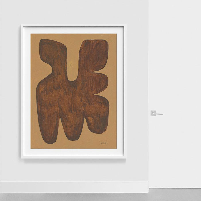 Large abstract print with two large brown organically shaped forms on a tan background in a white frame on a white wall