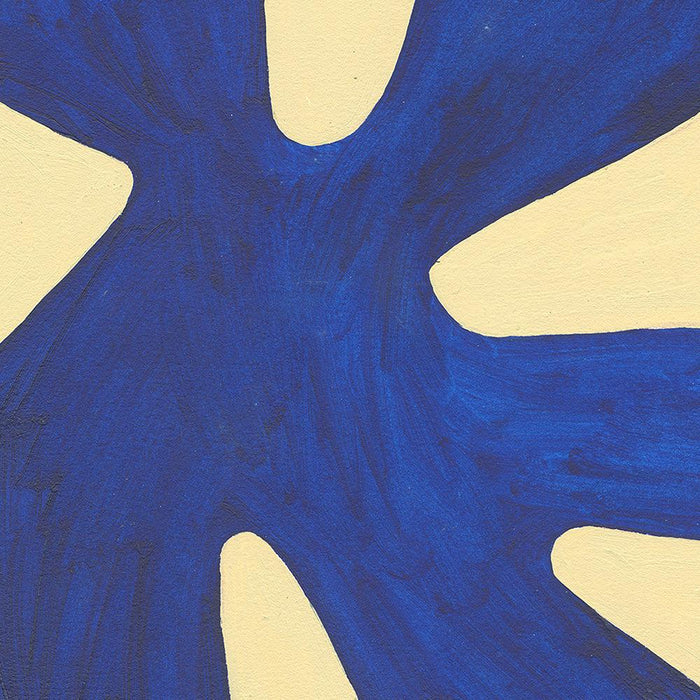 Close-up of an abstract print with a dark blue rounded X-shaped form on a light yellow background showing brushstrokes