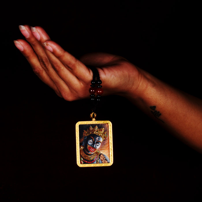Mahakala Ghau Thangka locket with hand-painted fierce protector deity artwork inside traditional Himalayan amulet Nepal