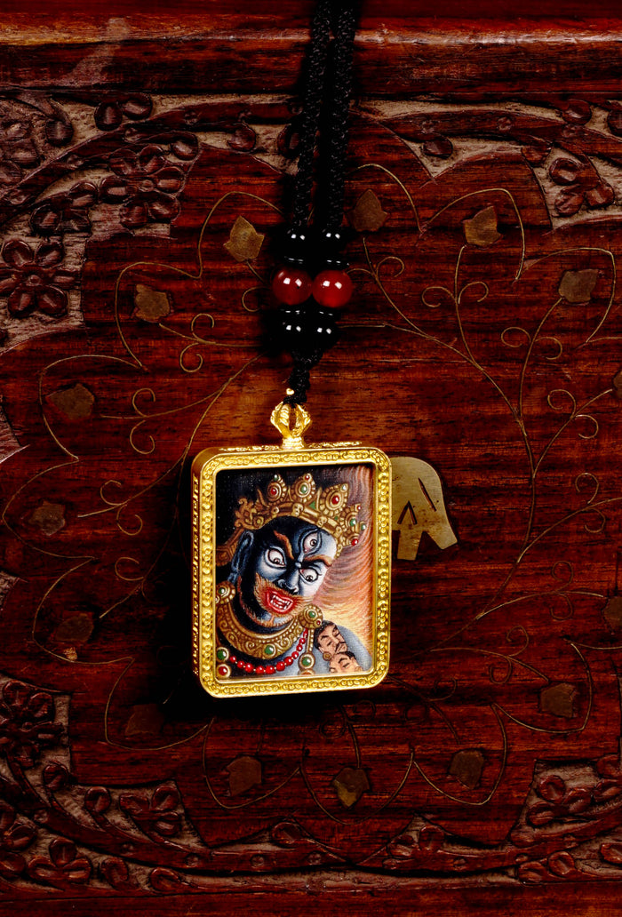 Mahakala Ghau Thangka locket with hand-painted fierce protector deity artwork inside traditional Himalayan amulet Nepal