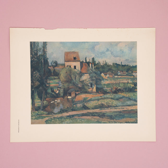 A vintage French offset lithograph of a Cézanne painting, featuring a rural French scene with trees, houses, and a barn.