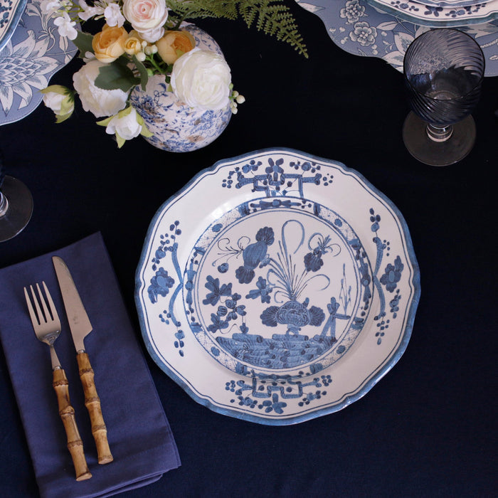 Beatriz Ball Vida Faenza Dinner Plate — Overhead plate beside flowers and flatware